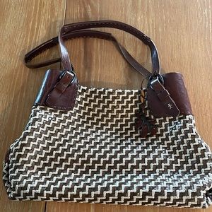 Really nice Henry Beguelin purse. Leather cross weave and handles.